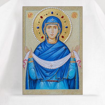 Icon of the Mother of God Protection n blue vestment with pearls and semi-precious stones