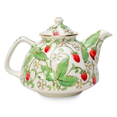 handmade nice summer teapot with berries flowers leaves