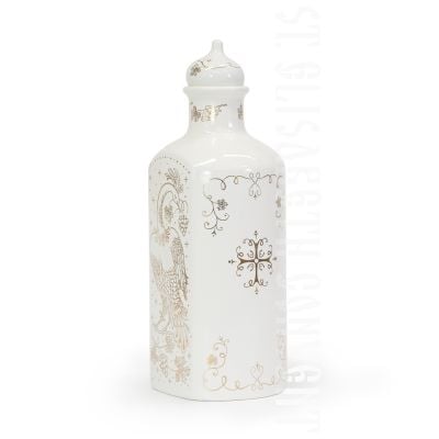 white ceramic bottle with grapes and a bird