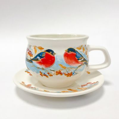 ceramic cup with bullfinch on the branch