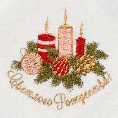 white linen table napkin with Christmas embroidery and merry Christmas inscription