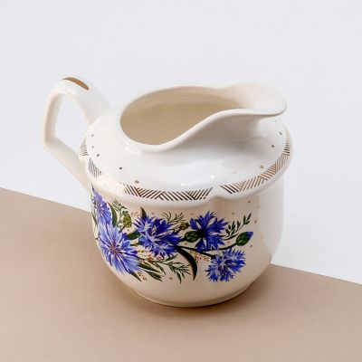 ceramic creamer with blue cornflowers and gold elements
