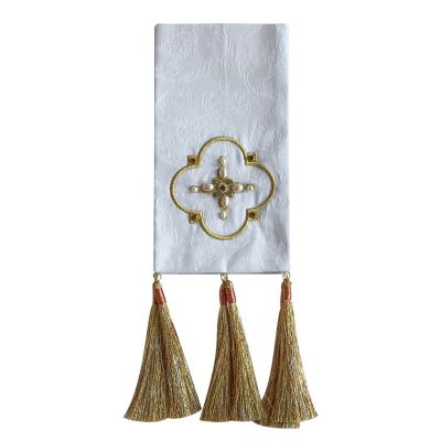 white bookmark with embroidered cross and decorated with pearls and tassels