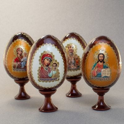 wooden eggs with icons and colorful backgrounds
