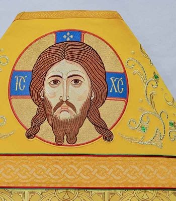 yellow Russian-style priest vestment for a divine liturgy with Jesus icon