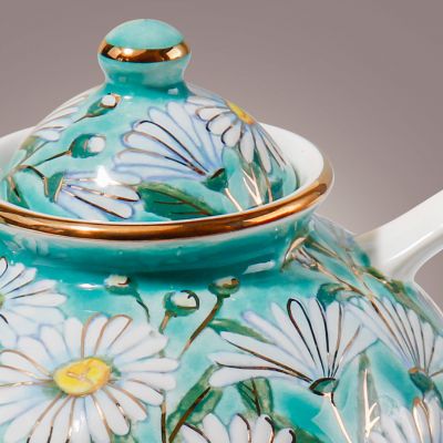 ceramic teapot with hand-painted daisies