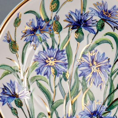 ceramic cup and saucer set with blue hand-painted cornflowers