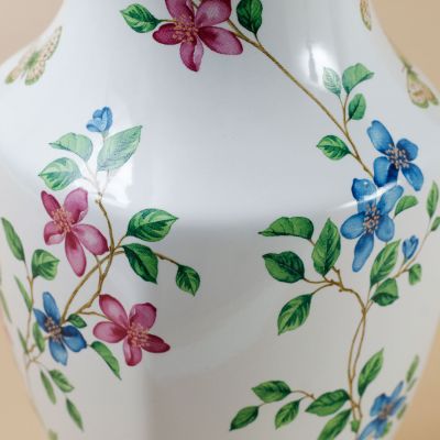 ceramic vase with flowers and butterflies inside and out