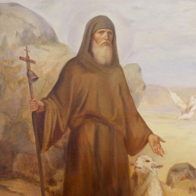 handpainted picture of st. Anthony the Great in the desert with a sheep and dove
