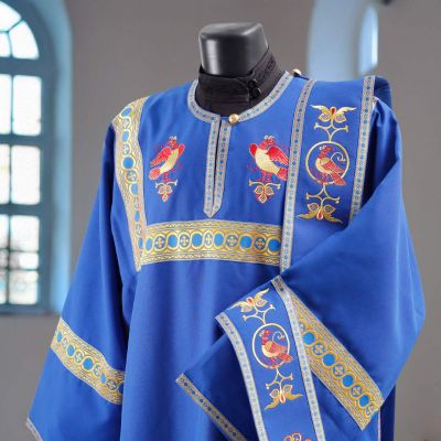 blue gabardine deacon vestment with embroidered birds and crosses