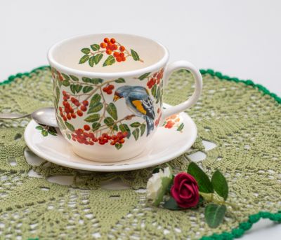 cup and saucer set with birds and rowan tree branches