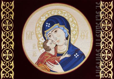 burgundy velvet khorugv with an embroidered icon of the mother of god