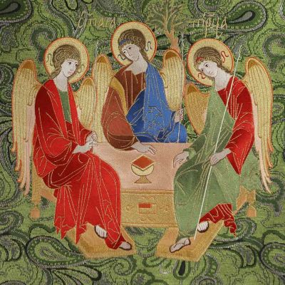 green decorative lectern cover with an icon