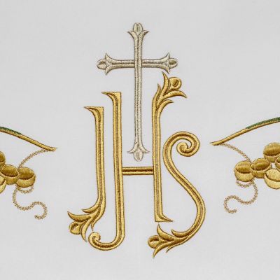 white altar frontal with embroidered grapes and cross and crops 