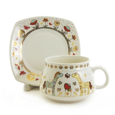 ceramic cup and a saucer set with horses