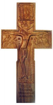 handcarved cross with Jesus and prayer