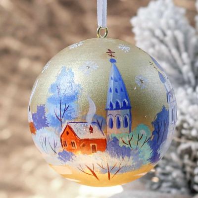golden sparkling bauble with a church painting