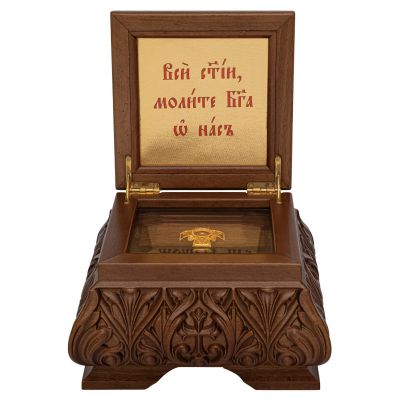 wooden reliquary with carved cross