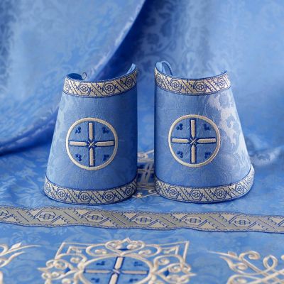 blue decorative priest vestment with embroidered Paschal patterns with Saints