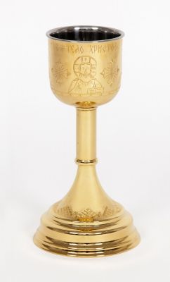 gilded chalice with engraved icons of Jesus and crosses