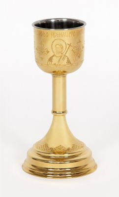 gilded chalice with engraved icons of Jesus and crosses