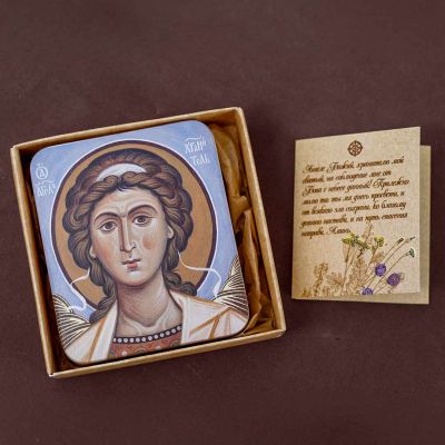wooden square icon of the Guardian angel light blue background