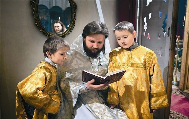 priest and altar boys